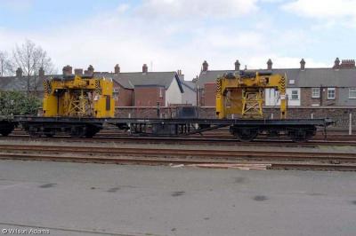 image showing a large yellow on-track machine
