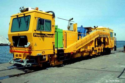image showing a large yellow on-track machine
