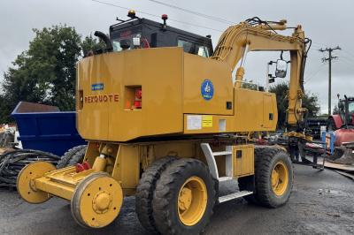 image showing a large yellow on-track machine