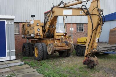 image showing a large yellow on-track machine
