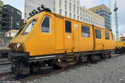 image showing a large yellow on-track machine