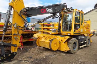 image showing a large yellow on-track machine