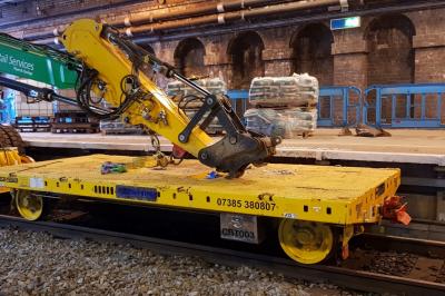 image showing a large yellow on-track machine
