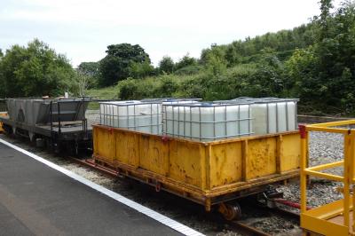 image showing a large yellow on-track machine