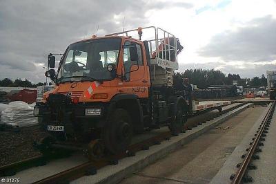 image showing a large yellow on-track machine