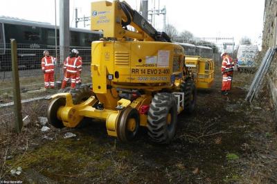 image showing a large yellow on-track machine