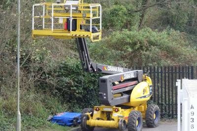 image showing a large yellow on-track machine