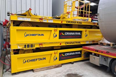 image showing a large yellow on-track machine