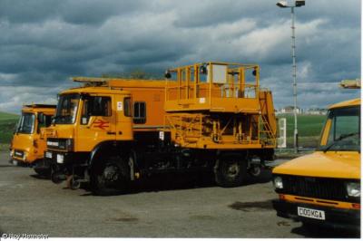 image showing a large yellow on-track machine