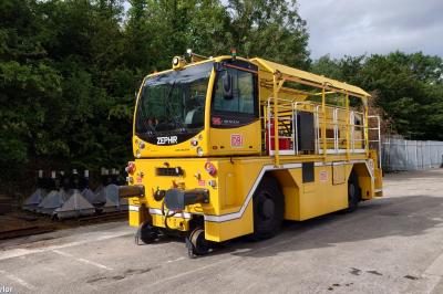 image showing a large yellow on-track machine