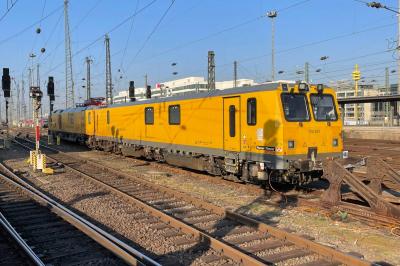 image showing a large yellow on-track machine
