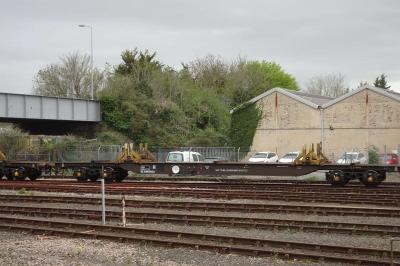 image showing a large yellow on-track machine