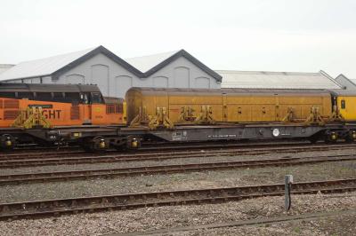 image showing a large yellow on-track machine