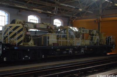 image showing a large yellow on-track machine
