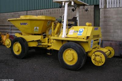 image showing a large yellow on-track machine