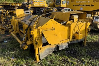 image showing a large yellow on-track machine
