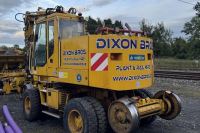 image showing a large yellow on-track machine