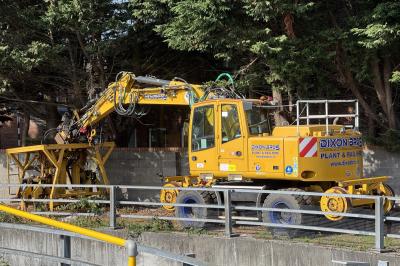 image showing a large yellow on-track machine