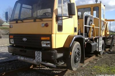image showing a large yellow on-track machine