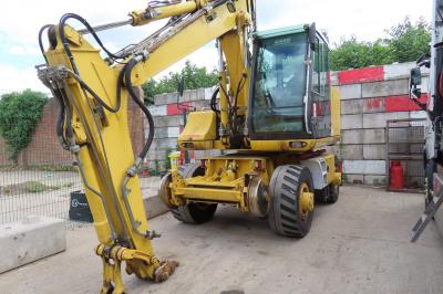 image showing a large yellow on-track machine