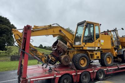 image showing a large yellow on-track machine