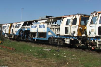 image showing a large yellow on-track machine