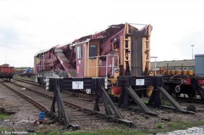 image showing a large yellow on-track machine