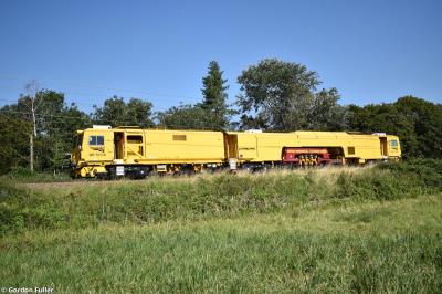 image showing a large yellow on-track machine