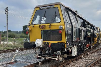image showing a large yellow on-track machine