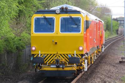 image showing a large yellow on-track machine