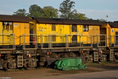 image showing a large yellow on-track machine