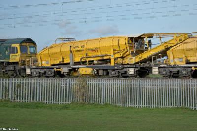 image showing a large yellow on-track machine