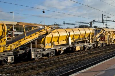image showing a large yellow on-track machine