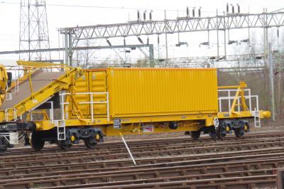 image showing a large yellow on-track machine