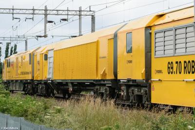 image showing a large yellow on-track machine