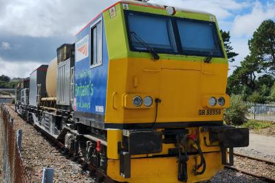 image showing a large yellow on-track machine