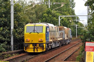 image showing a large yellow on-track machine