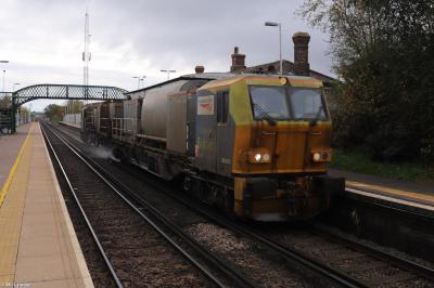 image showing a large yellow on-track machine