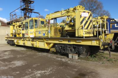image showing a large yellow on-track machine