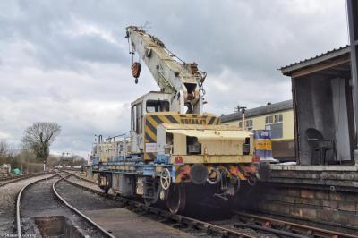 image showing a large yellow on-track machine