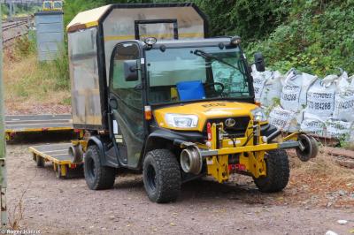 image showing a large yellow on-track machine