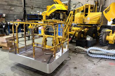 image showing a large yellow on-track machine