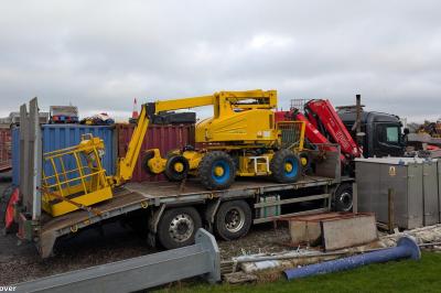 image showing a large yellow on-track machine