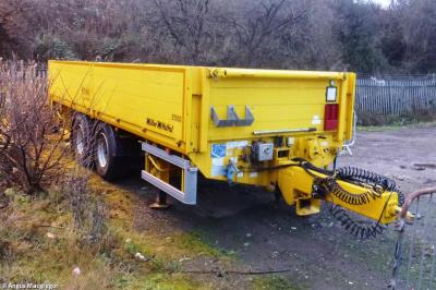 image showing a large yellow on-track machine