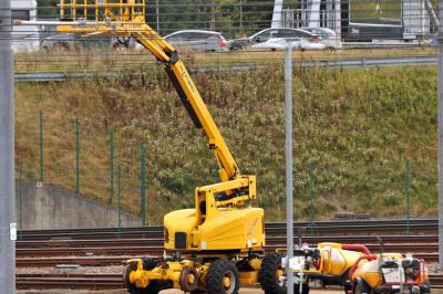 image showing a large yellow on-track machine