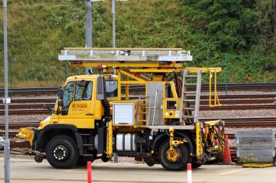 image showing a large yellow on-track machine