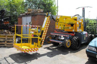 image showing a large yellow on-track machine