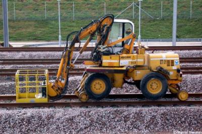 image showing a large yellow on-track machine