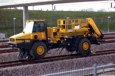 image showing a large yellow on-track machine