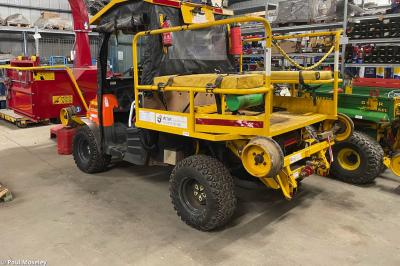 image showing a large yellow on-track machine